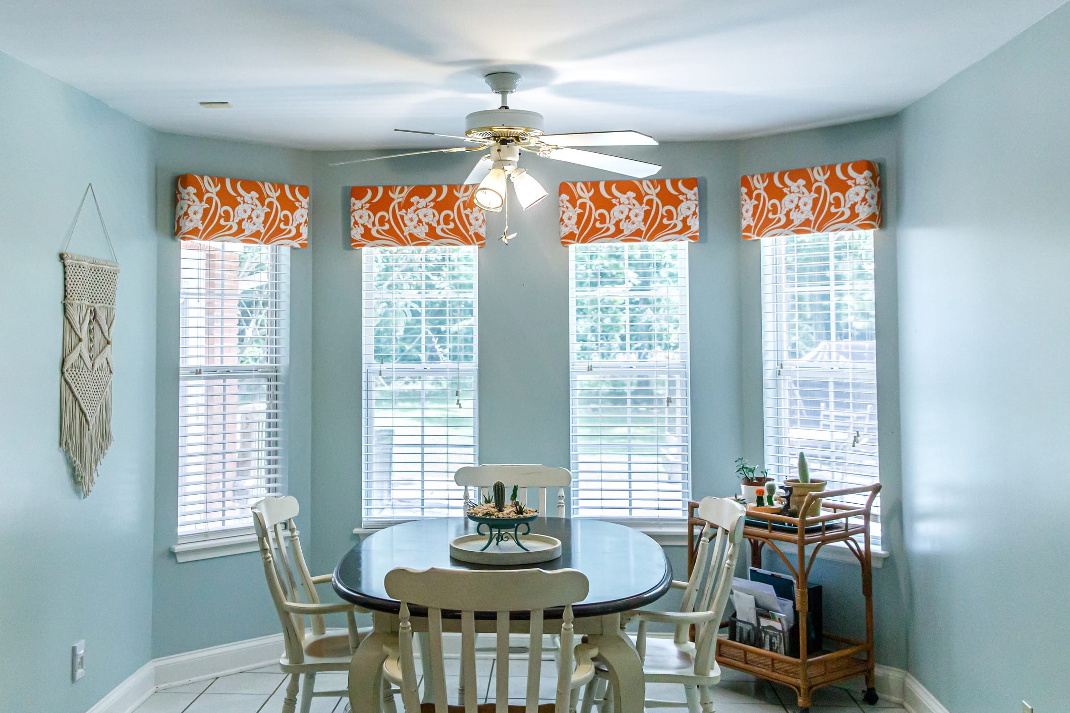 orange fabric window valances in breakfast nook